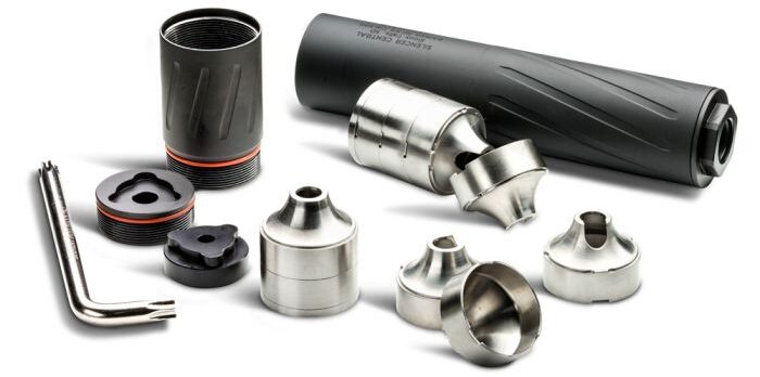 b30_v2_-_4 - PopularSuppressors Assorted metal nozzle adapters and a black handle-like tool laid out on a white background.