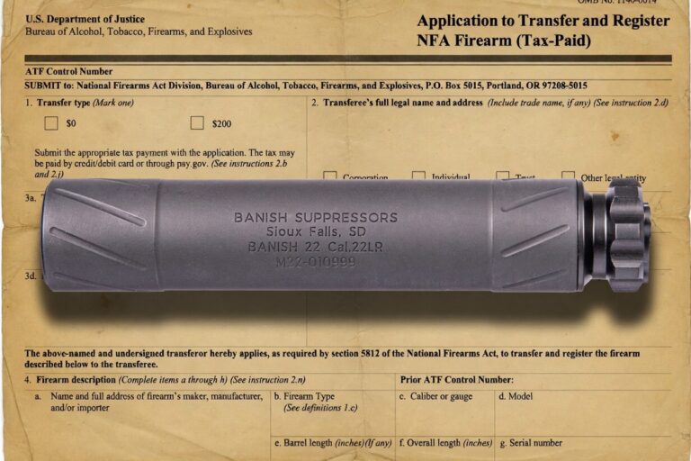 Gray suppressor lying atop a yellowed transfer form titled 'Application to Transfer and Register NFA Firearm (Tax-Paid)'; the canister is labeled 'BANISH SUPPRESSORS Sioux Falls, SD BANISH 22 Cal.22LR' with a knurled end cap visible on the right.