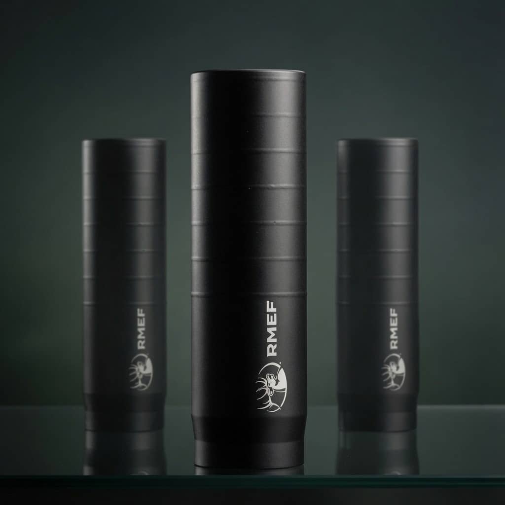 Three black cylindrical bottles with ribbed texture and the RMEF logo, arranged on a glass surface.