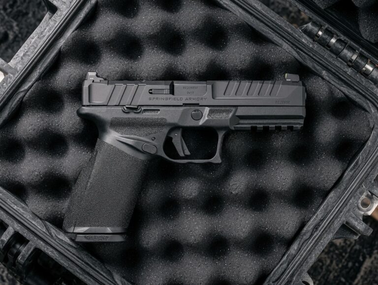 Black semi-automatic pistol resting in a foam-padded protective case labeled Springfield Armory