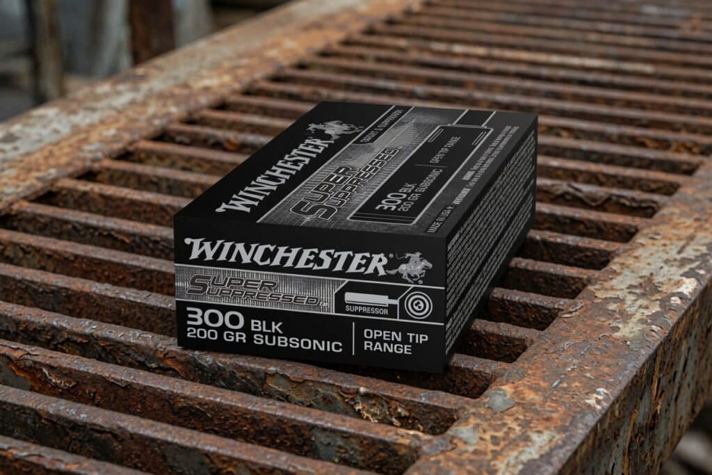 Box of Winchester Super Suppressed 300 Blackout subsonic ammunition (200 gr) on a rusted metal surface, Open Tip Range printed on box.