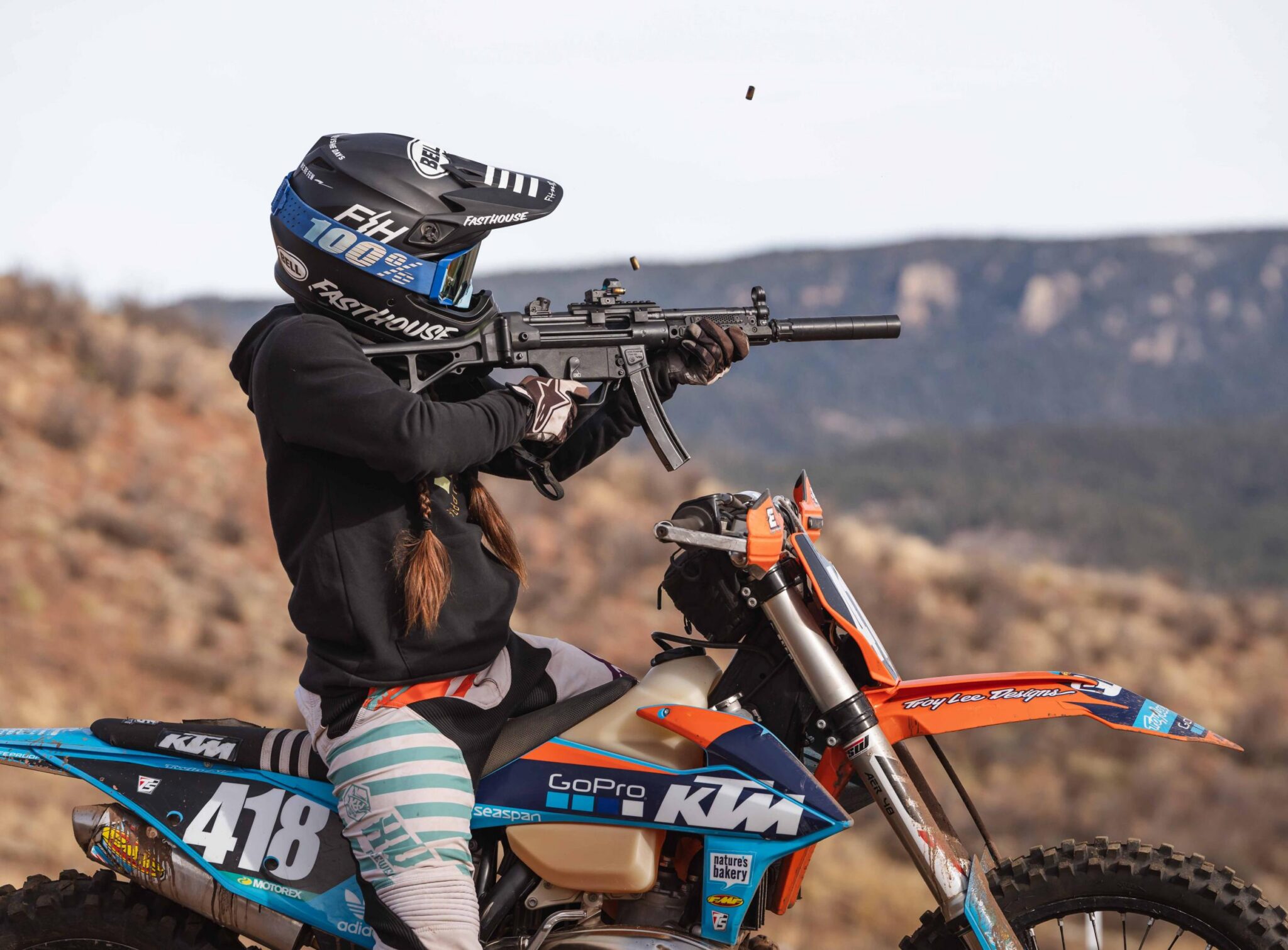 Rugged suppressor on MP five motorcycle rider - PopularSuppressors Rugged suppressor on MP five motorcycle rider