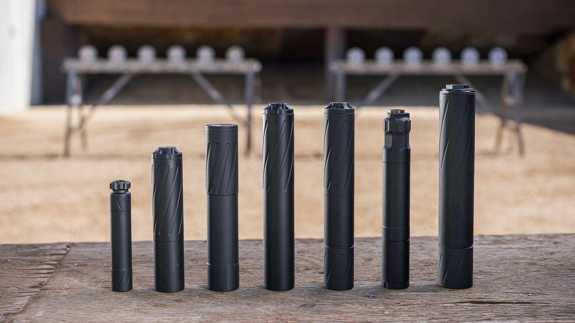 A row of suppressors from several manufacturers